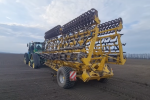 In the beet field with Alligator 12 m with folding system In the beet field with Alligator 12 m with folding system